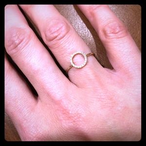 Diamond circle ring set in 14k yellow gold.
